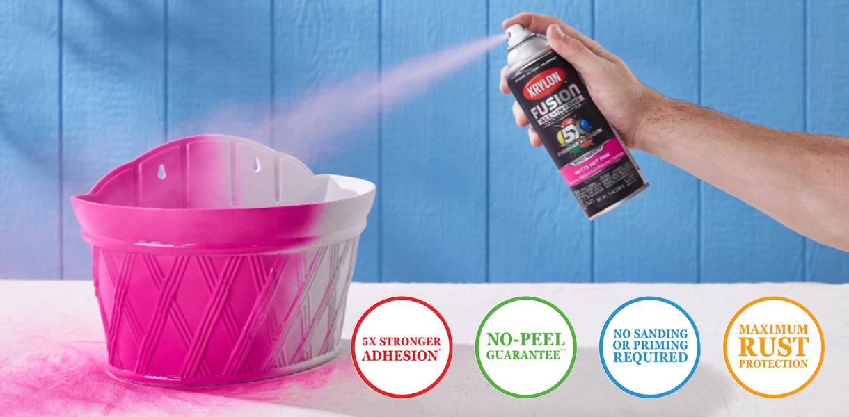 Spraying a basket pink with Krylon Fusion Spray Paint.