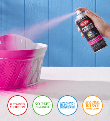 Spraying a basket pink with Krylon Fusion Spray Paint.