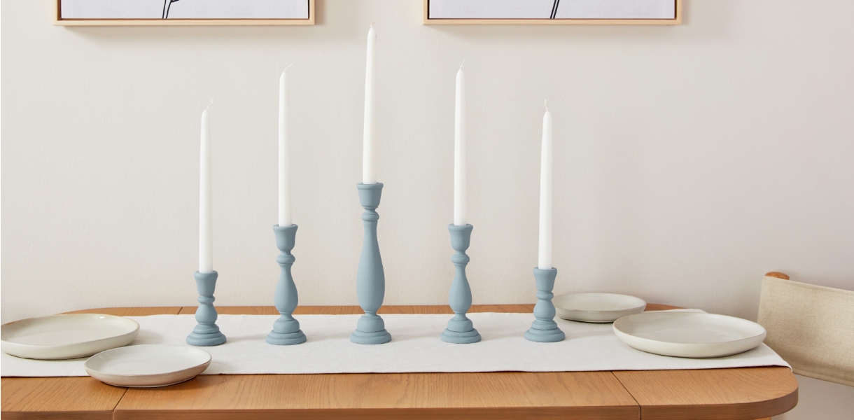 Table with candles and plates.