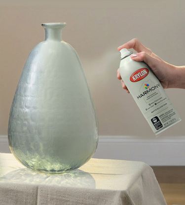Spraying a large vase with Krylon Harmony