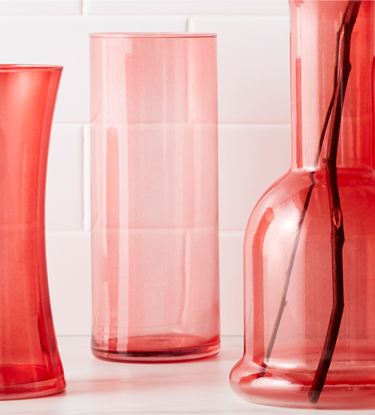 assortment of red stained glass vases