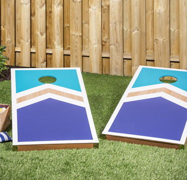 Two cornhole boards painted in different colors