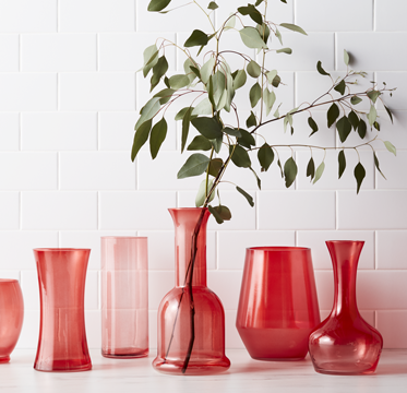 Assortment of glass vases painted red