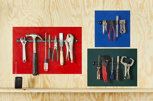 selection of hand tools on colored backgrounds